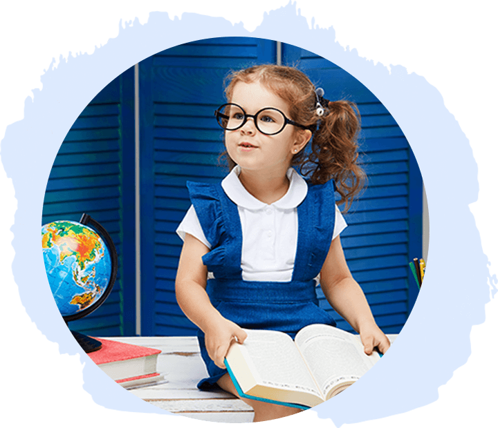 Child reading with globe